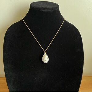 White and gold enamel egg Russian inspired necklace with rhinestones